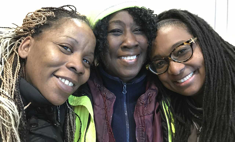 Kattie Eason flanked by, left, parent Aquenda Doyle, and right, special education teacher Sheena Brown (photo by Tom Rademacher)