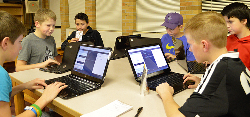 Robotics students work on coding