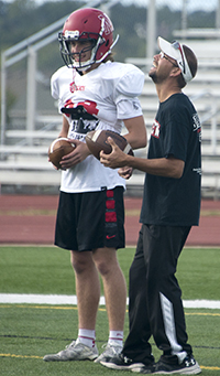 Alanowski enjoys a laugh with Northview player Kendrick Rhines 