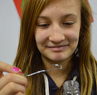 Alissa Minaker looks at the DNA she extracted from wheat germ