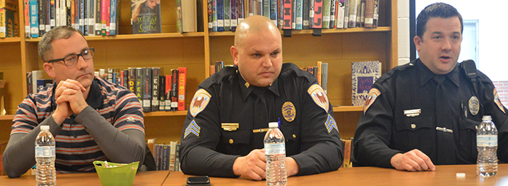 From left, Wyoming Public Safety Department Lt. Jim Maguffee, Sgt. Brian Look and Wyoming Public Schools Resource Officer Rory Allen talk to Wyoming High School students