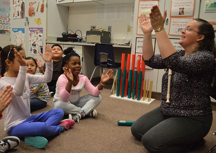 Music teacher Tami Nelson’s class claps to the beat