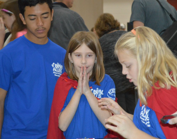 Kung Foo Panda team members Olivia Prindle, left, and Hannah Kempf from Grandville Grand View Elementary are tense when their robot starts its trek, excited when it accomplishes its missions and overjoyed when it completes them all