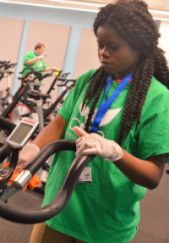 Lidie Mubiyayi of Grand Rapids Union High wipes down spin cycles