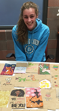 Senior Kelly Keen led the effort to have students decorate supper sacks for Kids’ Food basket