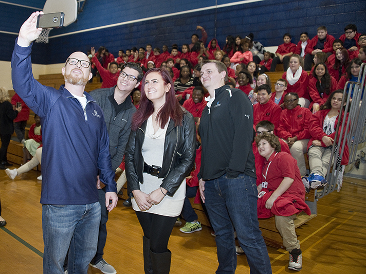 Company employees capturing the moment with a photo include, from left, Adam Earle, Jon Gagnon, Brianna Land and Brad Stiles