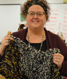 Teacher Rebecca English teaches students to knit