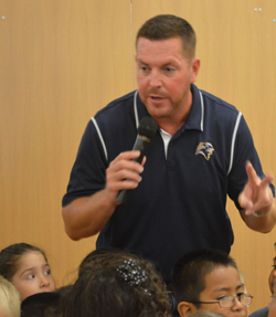 Principal Steve Minard counts down with kindergartners before shouting, “West Godwin rocks!”