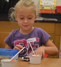 A student at Wyoming’s West Elementary has some breakfast during orientation