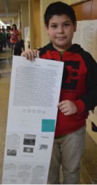 Fourth-grader Abel Garcia shows his writing