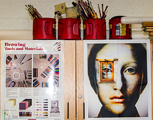 Inspirational posters line the classroom wall