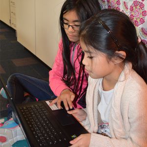 Endeavor Elementary fifth-graders Christine Tran and Amberly Nguyen practice coding