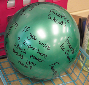 Students used props to answer questions about themselves