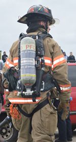 A firefighter assists at the scene