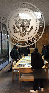 Students in Amy Holubeck’s eighth-grade class at Gerald R. Ford Academic Center examine presidential documents at the Gerald R. Ford Presidential Library in Ann Arbor