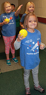 Natalie Norman gets encouragement from fellow students as she prepares to take her turn at bocce ball