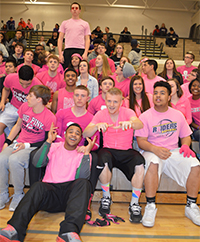 Students gather before a girl’s varsity basketball game