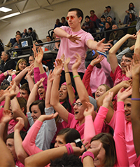 The students cheer on the home team