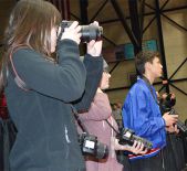 Tracking the game action are (from left) graphic communications students Carrie Rister, Abby Downing and Greg Szudzik