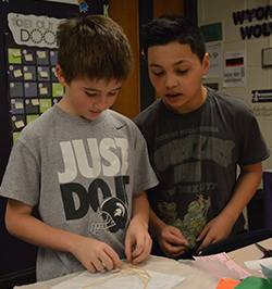 Caleb Beltram and Emansio Vasquez assemble their bridge