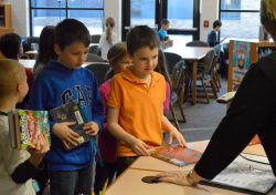 Stephen Ladd (left) and Zach Daimler check out their books for the week