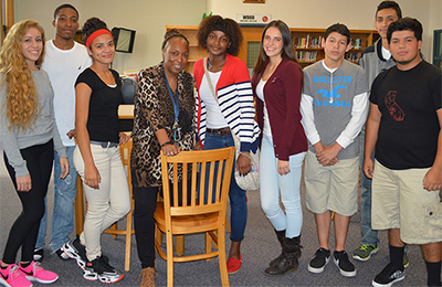 Students gather around Lee Middle/High School Principal Kathryn Curry