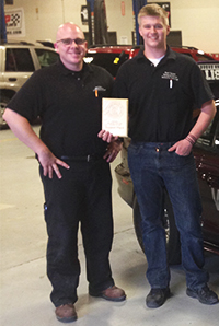  Branden Moelker, from Covenant Christian High School, shows off MITES awards with instructor Ryan Hardy