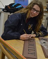 East Grand Rapids High School senior Alicia Dills works in Advanced Art class