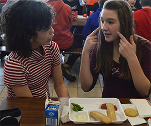 Maggie Maring has helped Jocelyn Noviskey learn sign language