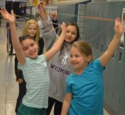 Students hold up their creation