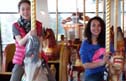 Chloe Larroque (left) and Clara Brunel enjoy a few laps on the carousel