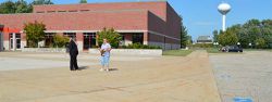 Kraft Meadows Elementary School in Caledonia is empty before the bus transfer begins. A few minutes later, more than 1,000 kids will fill the area as they get on their bus to go home