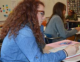 Shelby Oleksy takes notes on essay writing for advanced-placement tests