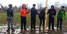 Students build a bridge across a flooded area