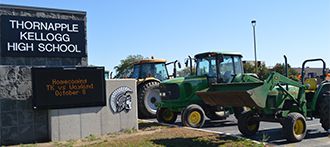 Tractors line up in the parking lot at Thornapple High School