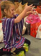 Lonnitta, a kindergartener at Cedar Trails, plays with a toy donated by her school