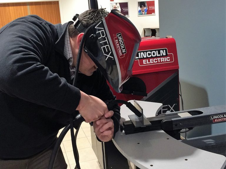 James Hissong, Kent ISD grants and development coordinator, tried his rather unsteady hand at welding, using a machine designed to teach welding skills using virtual reality technology