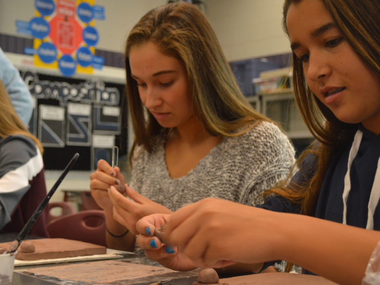 Students in art teacher Debra Kreuyer’s interior design class create spheres that are attached for a collaborative group mural called the Legacy Project