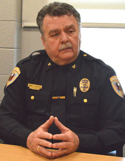 Wyoming Director of Police and Fire Services Chief James Carmody talks with Godwin Heights students about his plans to retire