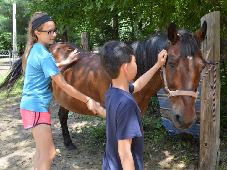 At summer camp, teacher and her family get to know students outside class