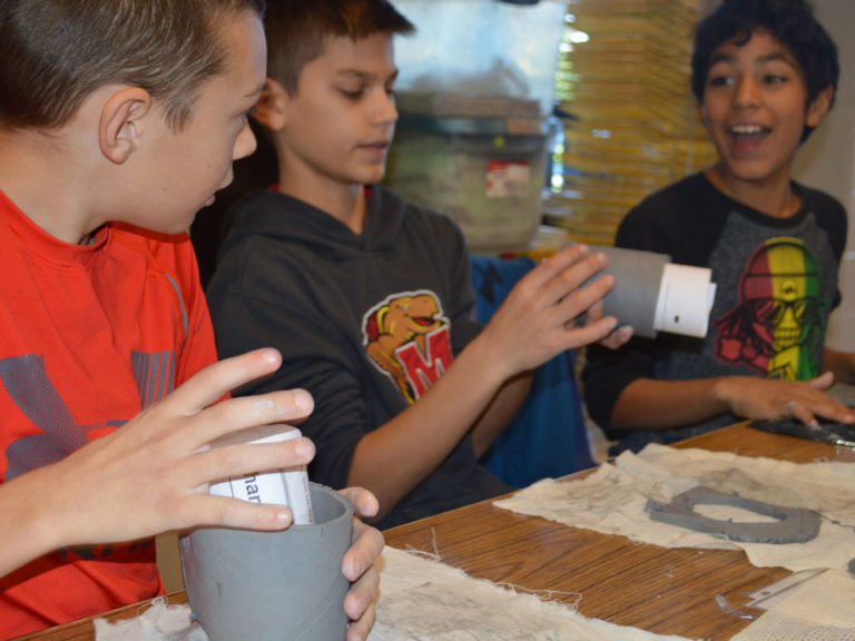 Students drink deeply of cultures while making cups with masks