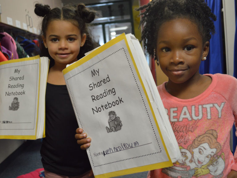 Kindergartners use notebooks to share reading with their families