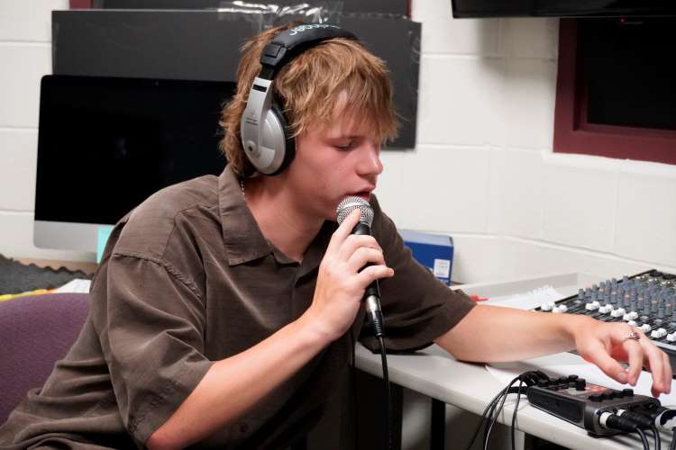 Evan Mattson works the audio recorder during a recording session for Hawk’s Nest