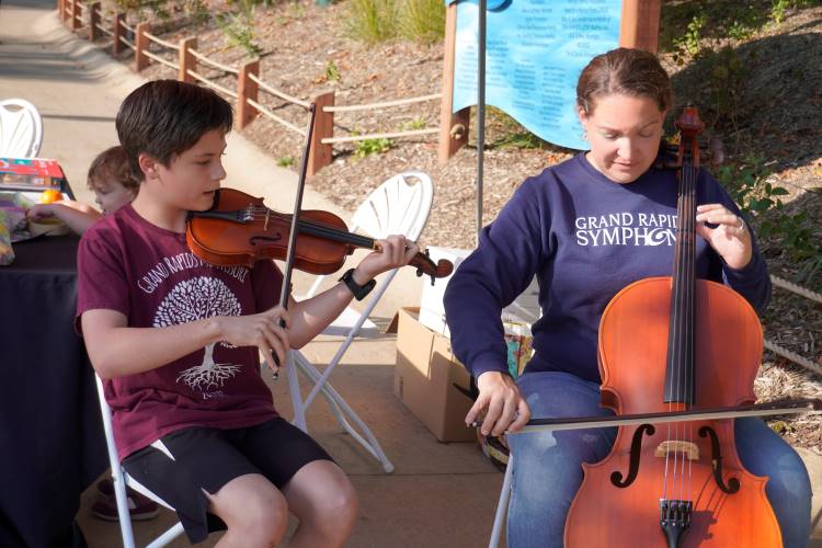 Grand Rapids City High eighth-grader Jack Morgan performs a short duet with Sarah Stickney, Grand Rapids Symphony director of education 
