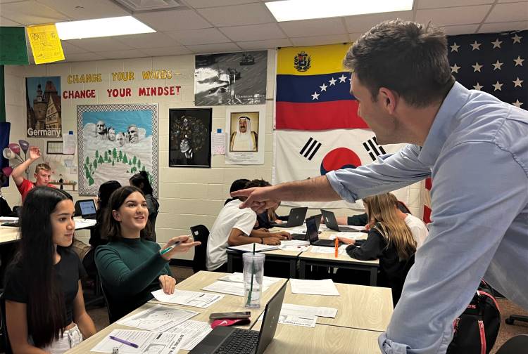 East Kentwood history teacher Matt Vriesman connects with students during the game Mansa Musa