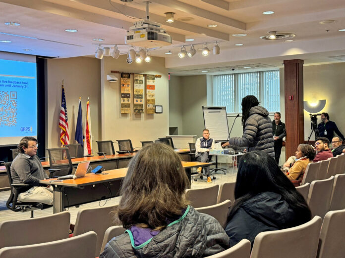 A resident speaks during a community meeting hosted by Grand Rapids Public Schools