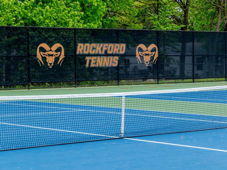 Tennis court with Rockford Rams banner on the fence