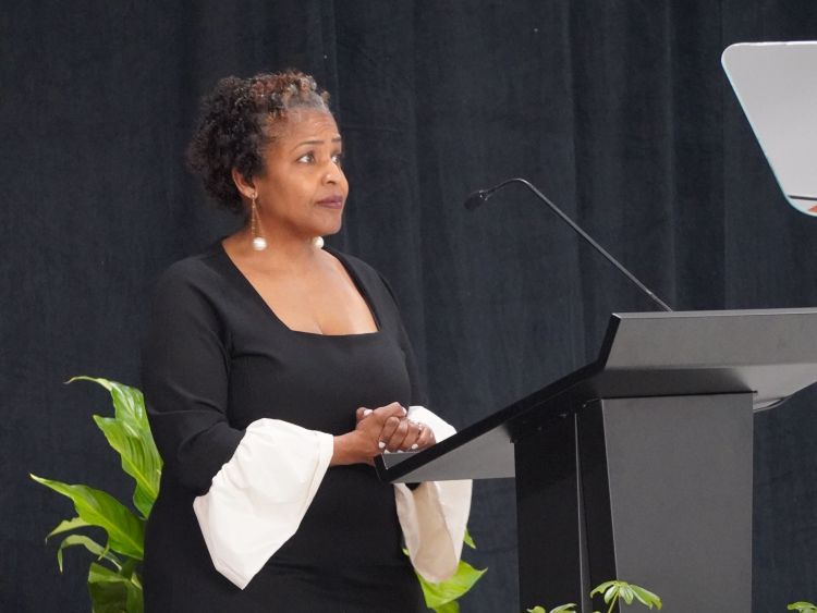 Superintendent Leadriane Roby stands behind a podium.